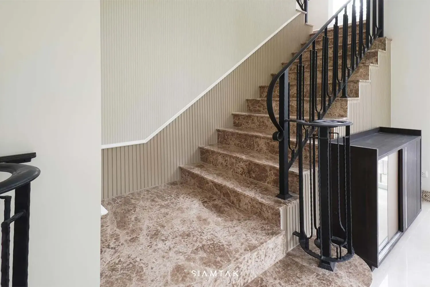 Selike Emperador marble staircase with random stone patterns