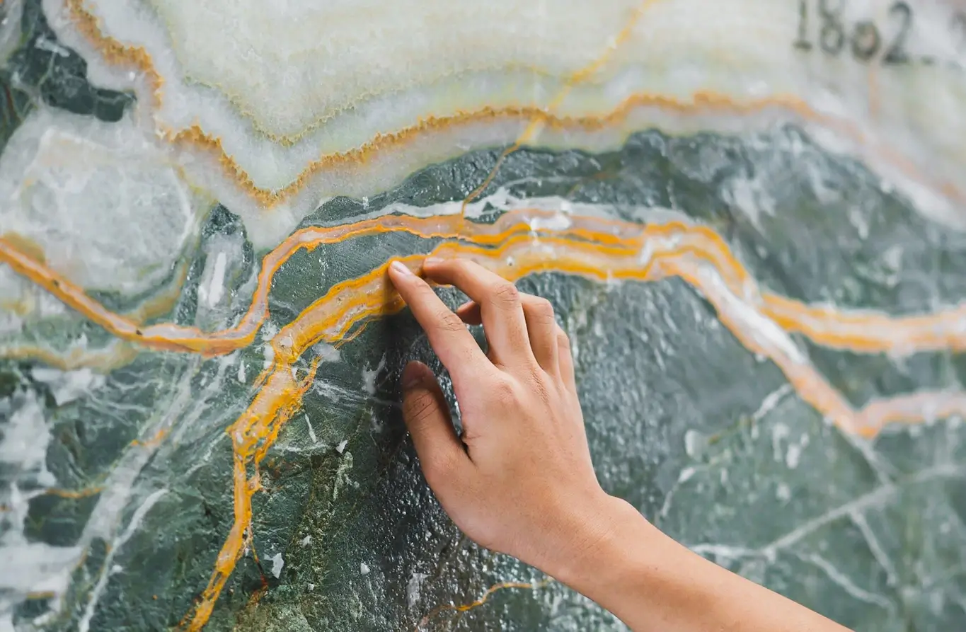 Feel the mineral veins on the Van Gogh Onyx marble