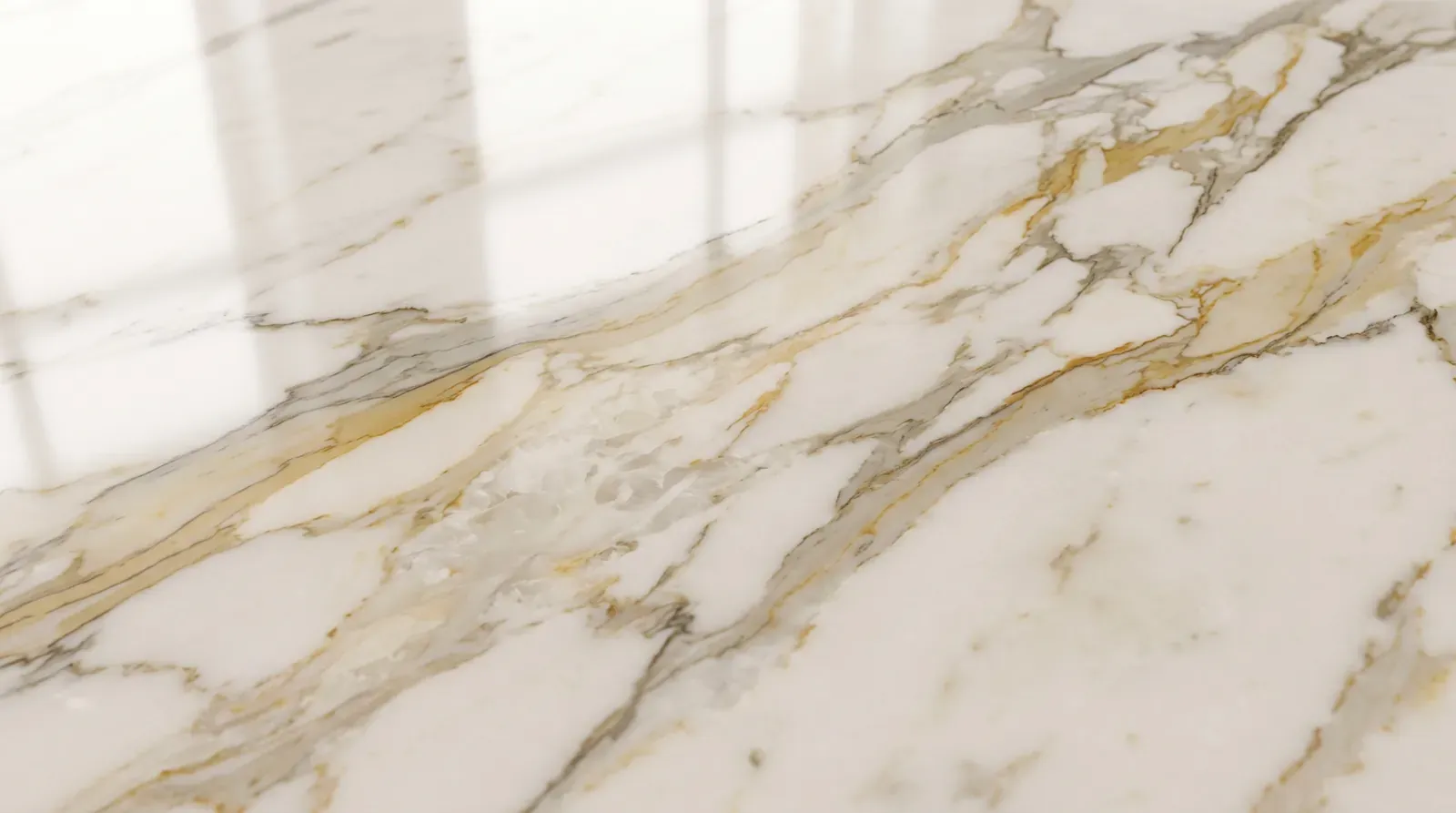 Polished marble surface reflecting light and bringing out the veining