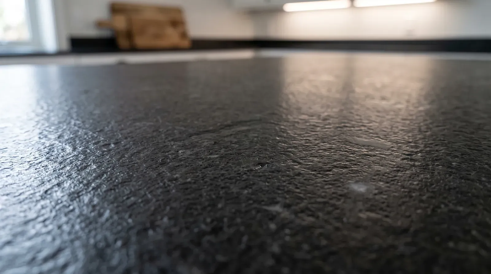 Close-up of dark granite with a tactile leathered finish